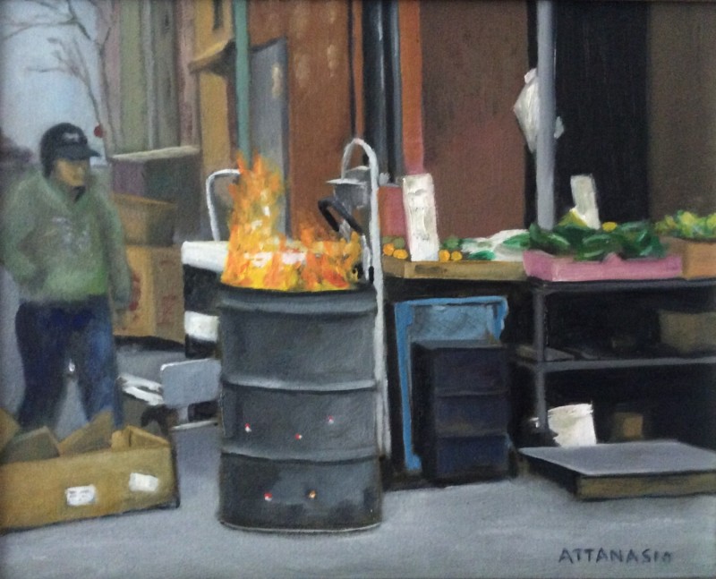 Man at fire barrel in Italian Market, South Philadelphia