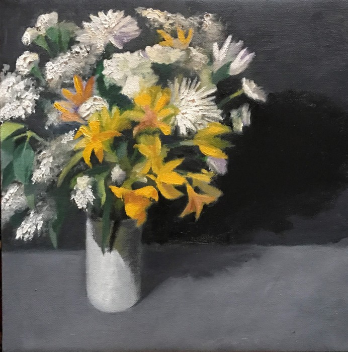 Bouquet of white and yellow flowers in white vase